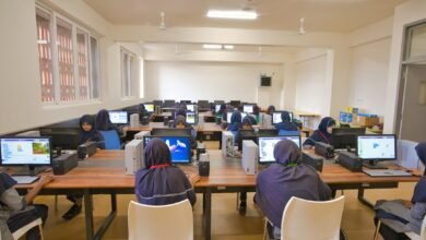 Real illustrative photograph of students using computers; not a One Million Coders Programme centre