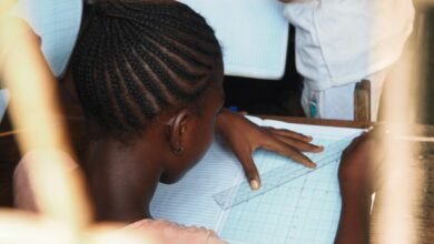 A schoolgirl working on a classroom exercise, illustrative photograph about girls' education and school safety